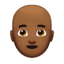 man: medium-dark skin tone, bald appearance on Apple