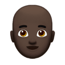 man: dark skin tone, bald appearance on Apple