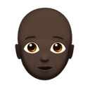 person: dark skin tone, bald appearance on Apple