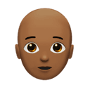 person: medium-dark skin tone, bald appearance on Apple