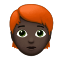 person: dark skin tone, red hair appearance on Apple